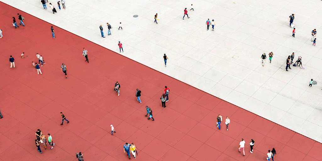 People walking on the red and white square